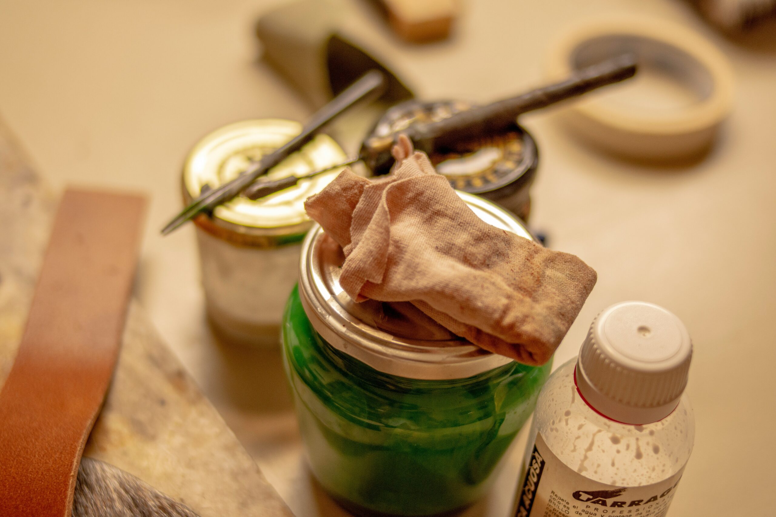 A close-up shot of someone mixing fresh ingredients in a rustic wooden bowl to prepare a homemade face mask.
