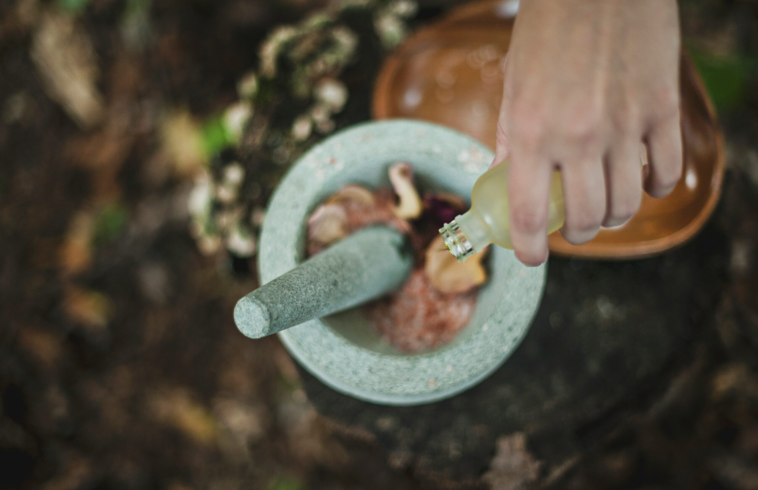 Woman holding skincare product made from organic plants