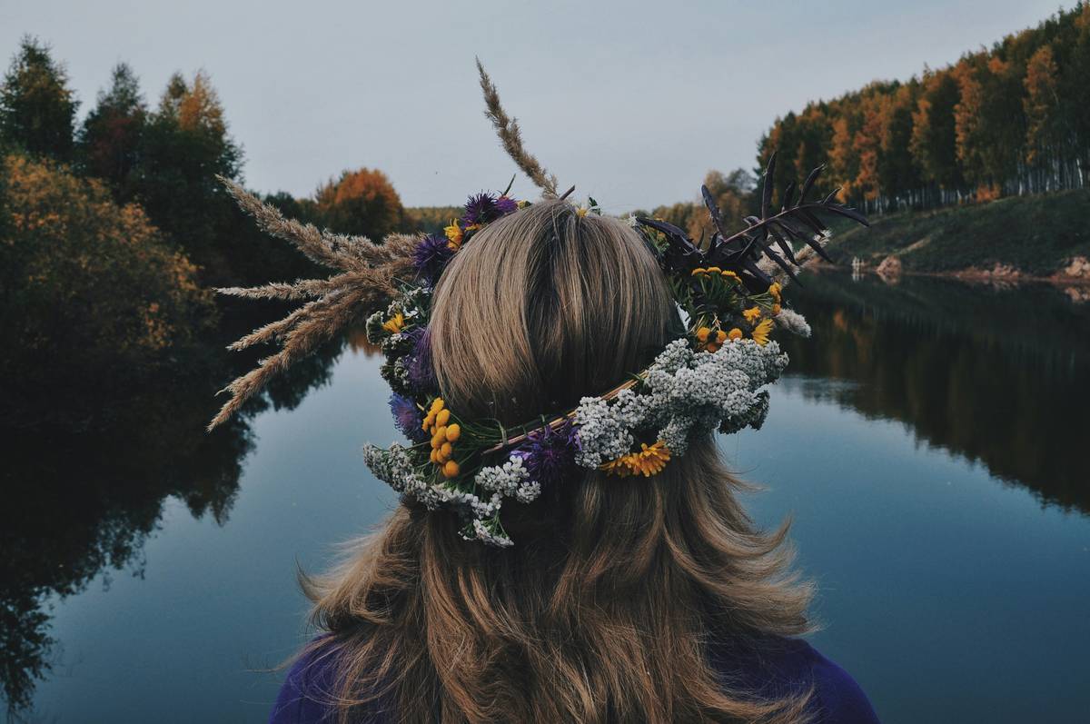 Planet Earth surrounded by green leaves symbolizing sustainable skincare.