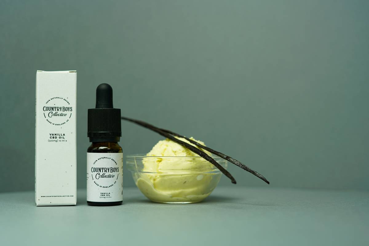 A close-up shot of a vibrant bromeliad plant surrounded by green leaves.